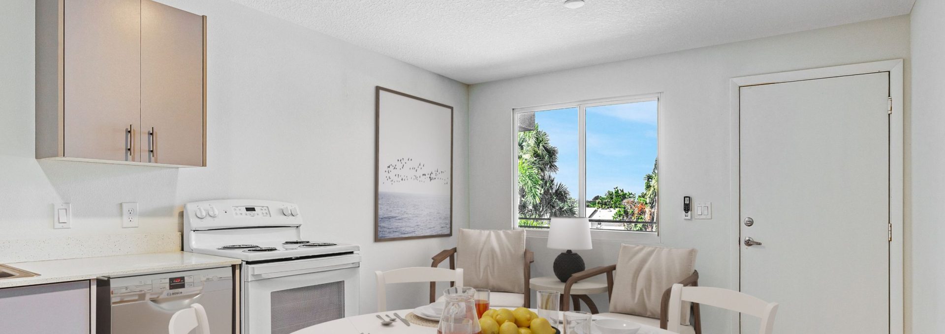 view of kitchen and table with overlook of river